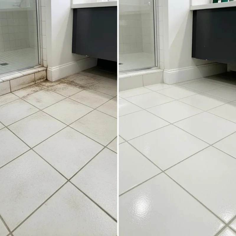 Technician steam-cleaning tile and grout in a contemporary New York City kitchen using eco-friendly methods